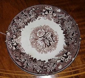 Plate with brown flowers